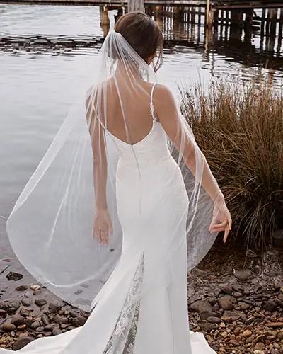 CONNOR-ML20025-FULL-LENGTH-CREPE-GOWN-WITH-V-NECKLINE-THIN-STRAPS-LACE-APPLIQUES-SCOOP-BACK-ZIPPER-CLOSURE-WEDDING-DRESS-MATCHING-VEIL-MADI-LANE-BRIDAL-10
