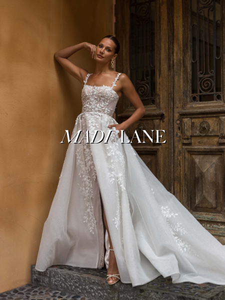 Model wearing a bridal gown by Madi Lane