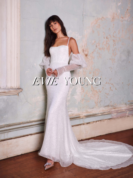 Model wearing a white gown by Evie Young