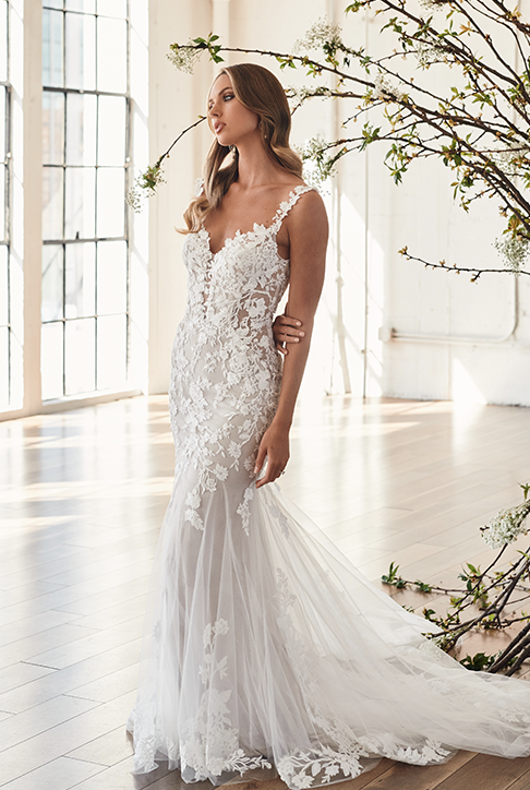 Model wearing a white gown by Serene Bridal
